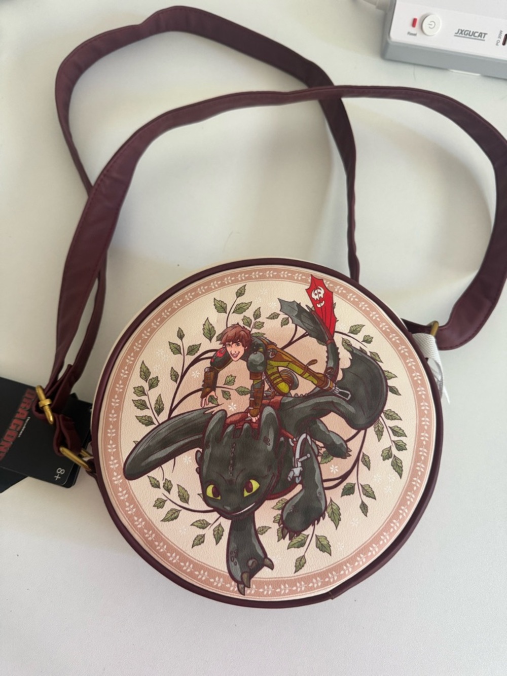 Loungefly Burgundy Round Crossbody Bag with Dragon Rider Illustration